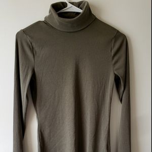 New w/o tags. Dark olive turtleneck top.